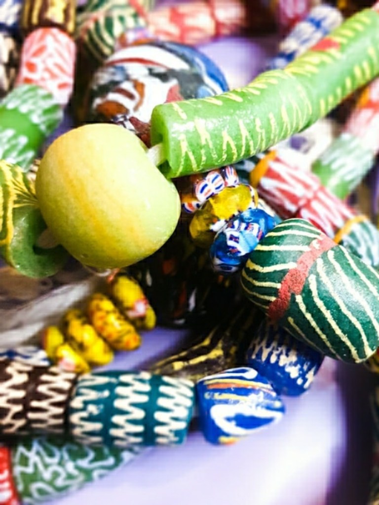 Bright jewellery beads in greens, blues, reds and yellows