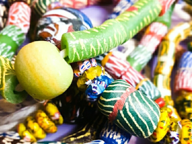Bright jewellery beads in greens, blues, reds and yellows