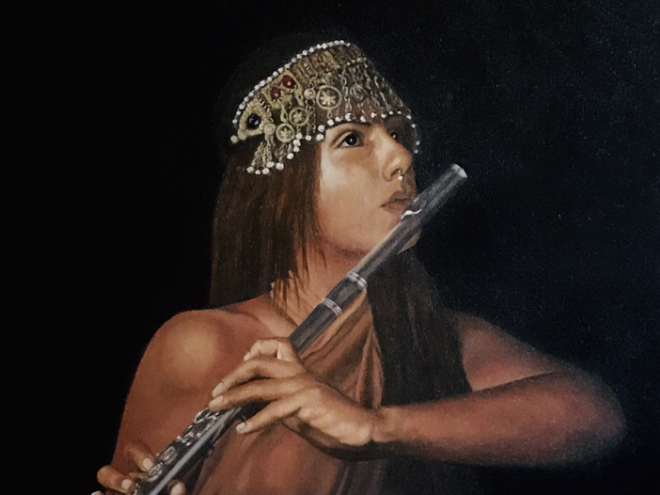 Woman with an ornate headdress plays the flute