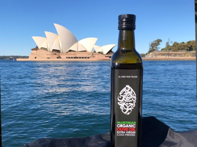 bottle of olive oil from palestine in front of the sydney opera house